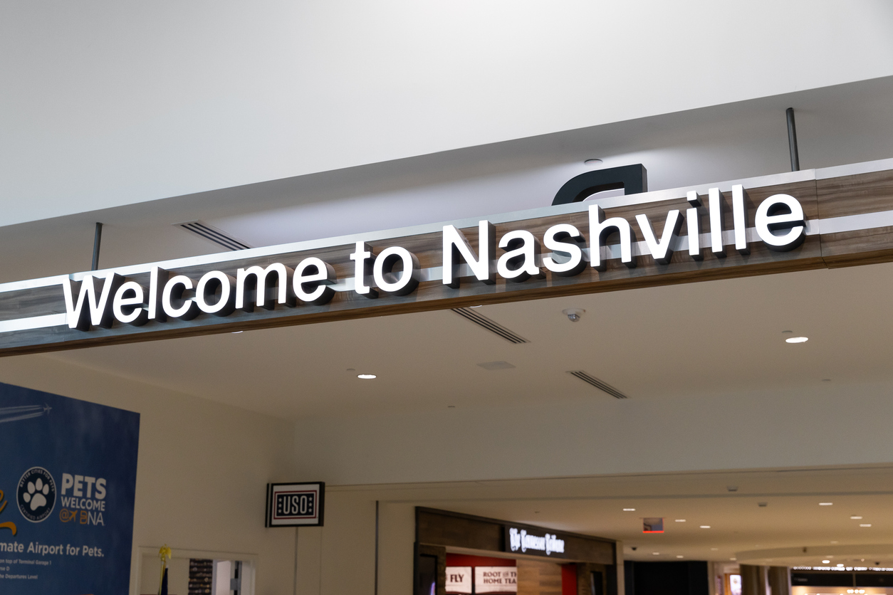 Welcome to Nashville sign at BNA Airport highlighting tourism growth and visitor arrivals in Nashville Tennessee